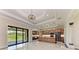 An open kitchen showcases modern appliances, sleek countertops, and access to an outdoor patio at 4380 Maddock Cir, North Port, FL 34286