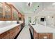 Kitchen with an island, wooden cabinets, granite countertops and stainless steel appliances at 4380 Maddock Cir, North Port, FL 34286