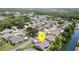 Lovely aerial view of a well-maintained residential area with lush landscaping and tranquil pond views at 541 Wekiva River Ct # 94, Englewood, FL 34223