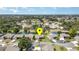 Aerial view of the home and neighborhood, showcasing the lush landscaping and community ponds at 541 Wekiva River Ct # 94, Englewood, FL 34223