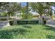The 'Park Forest' community sign is surrounded by lush greenery and mature trees at 541 Wekiva River Ct # 94, Englewood, FL 34223