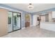 Dining room with tile floors, view to kitchen, and sliding door access to the screened porch at 541 Wekiva River Ct # 94, Englewood, FL 34223