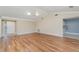 Inviting living room with wood floors and views into the kitchen at 541 Wekiva River Ct # 94, Englewood, FL 34223