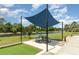 Charming outdoor seating area with shade and scenic lake views, perfect for relaxing or entertaining at 541 Wekiva River Ct # 94, Englewood, FL 34223