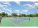 A view of community pickleball courts, enclosed by fencing for recreation at 541 Wekiva River Ct # 94, Englewood, FL 34223