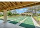 Enjoy outdoor recreation on these shaded shuffleboard courts, adding a fun and social element to the community at 541 Wekiva River Ct # 94, Englewood, FL 34223