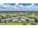 Aerial view of waterfront condo buildings with mature landscaping at 5725 Greenwood Ave # 2101, North Port, FL 34287