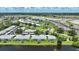 Aerial view of waterfront condo buildings with community pool and parking at 5725 Greenwood Ave # 2101, North Port, FL 34287