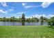 Backyard with a scenic view of a pond at 5725 Greenwood Ave # 2101, North Port, FL 34287