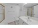 Bathroom featuring a shower, white vanity, toilet, and decor at 5725 Greenwood Ave # 2101, North Port, FL 34287