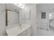 Bathroom featuring a mirror, white vanity, and doorway at 5725 Greenwood Ave # 2101, North Port, FL 34287
