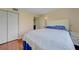 Bedroom with plush carpet, ceiling fan, and ensuite bathroom at 5725 Greenwood Ave # 2101, North Port, FL 34287