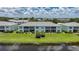 Rear exterior shot of the condo buildings facing a pond at 5725 Greenwood Ave # 2101, North Port, FL 34287