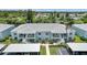 Lovely two-story condo building with carports and beautiful landscaping near canal at 5725 Greenwood Ave # 2101, North Port, FL 34287