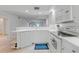 Efficient kitchen with white cabinets, and breakfast bar at 5725 Greenwood Ave # 2101, North Port, FL 34287