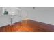 Bright living room features hardwood floors and a breakfast bar with seating at 5725 Greenwood Ave # 2101, North Port, FL 34287