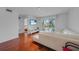 Open living space featuring a lake view from the sliding glass doors to the patio at 5725 Greenwood Ave # 2101, North Port, FL 34287