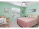 Relaxing bedroom includes a queen bed, lots of windows for natural light and calming decor at 5725 Greenwood Ave # 8203, North Port, FL 34287