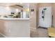 Bright kitchen featuring white cabinets, modern appliances, and a breakfast bar at 5725 Greenwood Ave # 8203, North Port, FL 34287