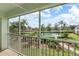 Screened lanai overlooking a community pool and lush landscaping, for relaxing outdoor living at 5725 Greenwood Ave # 8203, North Port, FL 34287