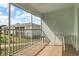 Enclosed lanai has tile floor, a table, chairs, and serene neighborhood views at 5725 Greenwood Ave # 8203, North Port, FL 34287