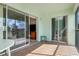 Tiled lanai with sliding glass doors leading to a bedroom and living area at 5725 Greenwood Ave # 8203, North Port, FL 34287