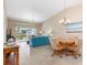 Open living space with vaulted ceilings, tile floors, and sliding doors to enjoy the view at 5725 Greenwood Ave # 8203, North Port, FL 34287