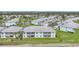 Aerial view of community with ponds and lush landscaping at 5762 Sabal Trace Dr # 203, North Port, FL 34287
