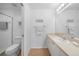 Clean bathroom with a toilet, shower stall, and vanity with ample counter space at 5762 Sabal Trace Dr # 203, North Port, FL 34287