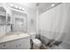 Bright bathroom features a shower with tub and vanity at 5762 Sabal Trace Dr # 203, North Port, FL 34287