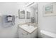 Clean bathroom with large mirror, vanity, and toilet at 5762 Sabal Trace Dr # 203, North Port, FL 34287