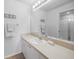 Well-lit bathroom with a vanity, a toilet, and a glass-enclosed shower stall at 5762 Sabal Trace Dr # 203, North Port, FL 34287