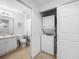 Bathroom and laundry closet feature a washer/dryer combo at 5762 Sabal Trace Dr # 203, North Port, FL 34287