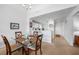 Dining room with seating for four, with views into the kitchen at 5762 Sabal Trace Dr # 203, North Port, FL 34287