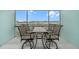 Screened-in patio with outdoor dining furniture and view at 5762 Sabal Trace Dr # 203, North Port, FL 34287