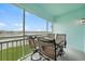 Patio with outdoor furniture overlooking grassy area at 5762 Sabal Trace Dr # 203, North Port, FL 34287