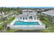 A beautiful in-ground community pool surrounded by lush landscaping at 5762 Sabal Trace Dr # 203, North Port, FL 34287