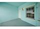 Covered porch features blue walls, gray floor, and an exterior light fixture at 5762 Sabal Trace Dr # 203, North Port, FL 34287