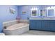 Stylish bathroom with a soaking tub and modern fixtures at 7183 Spinnaker Blvd, Englewood, FL 34224