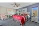 Cozy bedroom featuring a ceiling fan and soft carpet at 7183 Spinnaker Blvd, Englewood, FL 34224