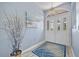 Inviting entryway with decorative glass doors, stylish lighting, and a patterned rug at 7183 Spinnaker Blvd, Englewood, FL 34224