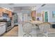 Well-equipped kitchen with a breakfast bar and modern appliances at 7183 Spinnaker Blvd, Englewood, FL 34224