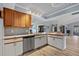 Modern kitchen with stainless steel appliances and a breakfast bar at 7183 Spinnaker Blvd, Englewood, FL 34224
