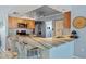 Modern kitchen with an eat-in bar, stainless steel appliances, and ample counter space at 7183 Spinnaker Blvd, Englewood, FL 34224