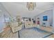Open-concept living area with stylish furnishings and views into the kitchen at 7183 Spinnaker Blvd, Englewood, FL 34224