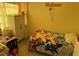 Bedroom with a window, bed, and yellow walls at 8158 Trionfo Ave, North Port, FL 34287