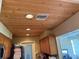 Wood ceiling with recessed lights complements the kitchen at 8158 Trionfo Ave, North Port, FL 34287