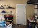 Organized garage area with shelving, storage containers, and a convenient access door at 8158 Trionfo Ave, North Port, FL 34287