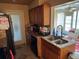 Well-lit kitchen featuring granite counters, wooden cabinets, and stainless steel appliances at 8158 Trionfo Ave, North Port, FL 34287