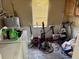 Cluttered laundry room featuring laundry appliances and window at 8158 Trionfo Ave, North Port, FL 34287
